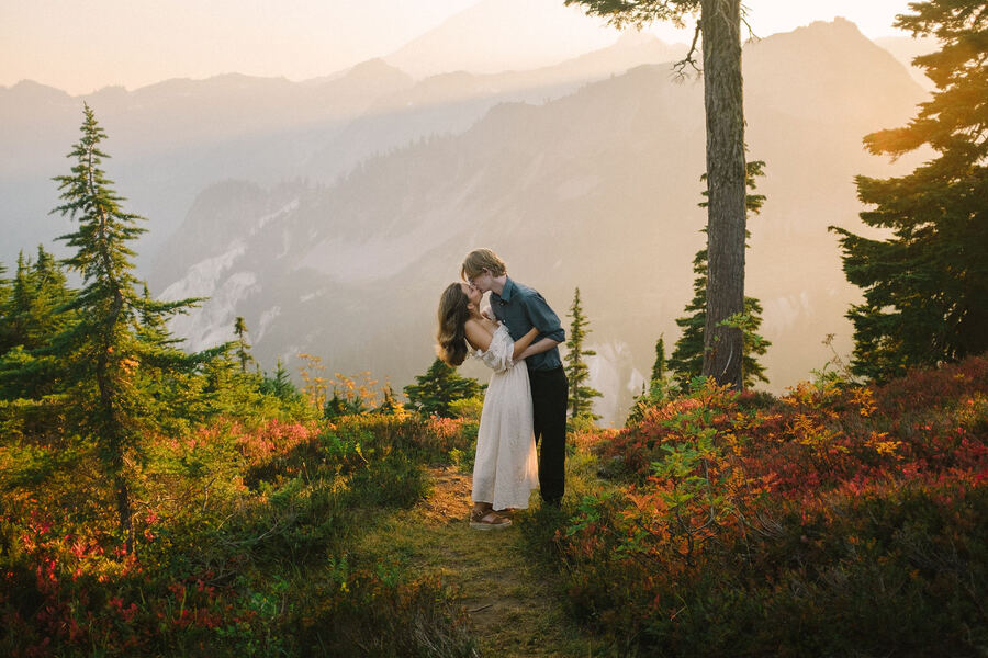 Couple on a mountain ridge at golden hour