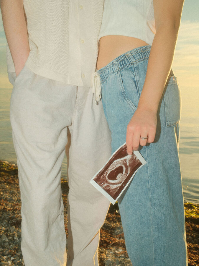 Couple holding hands and a Polaroid