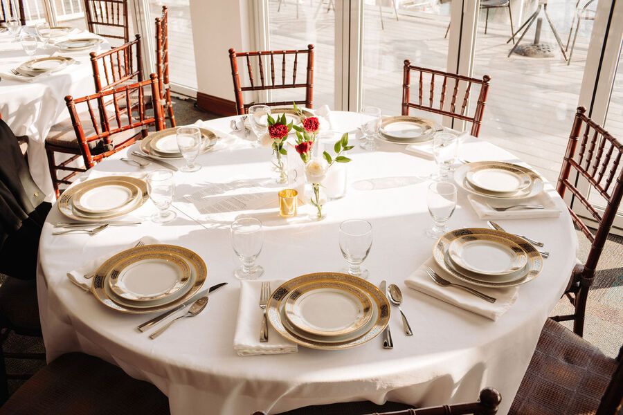 Reception table close-up with florals and china
