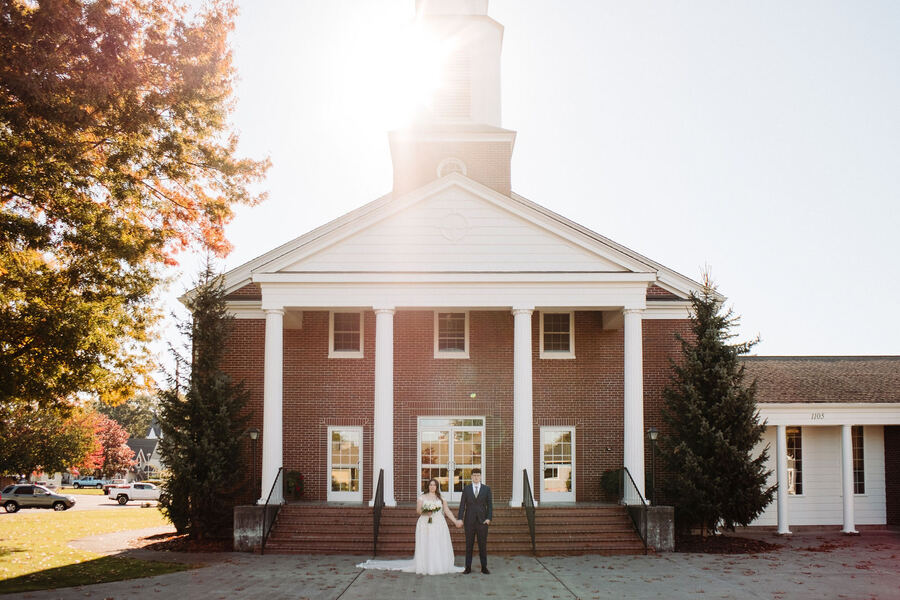 Couple in front of a historic chapel