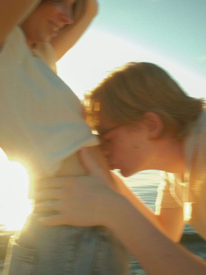 Backlit couple in soft sun flare